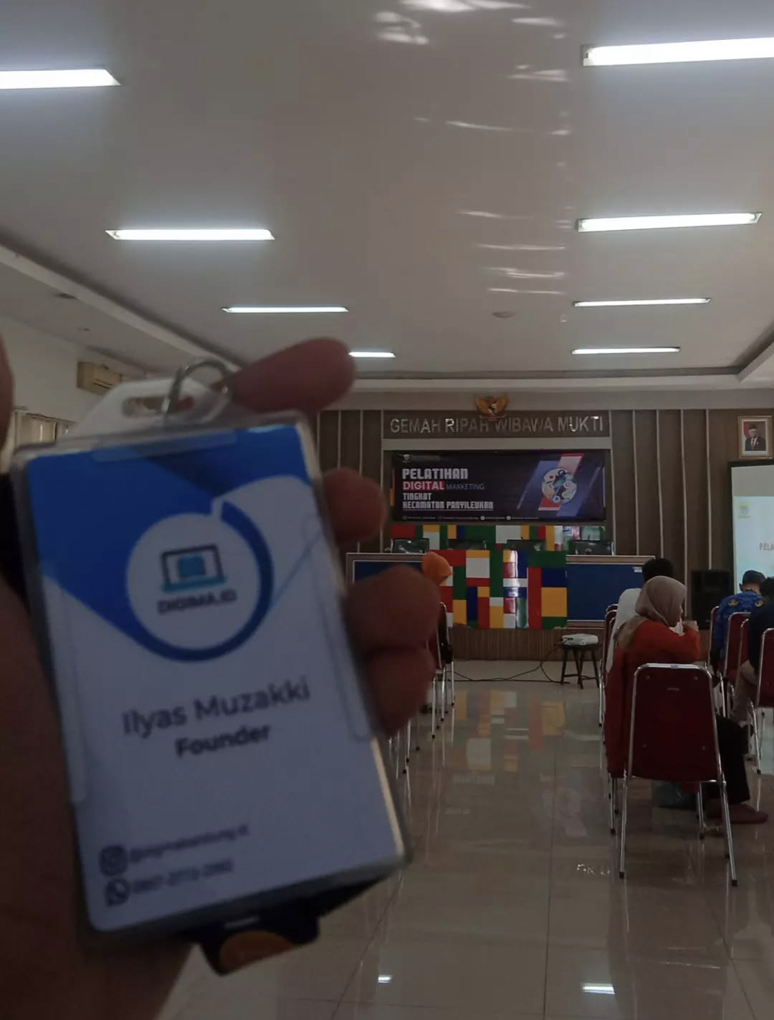 Founder name tag reading Ilyas Muzakki, Founder